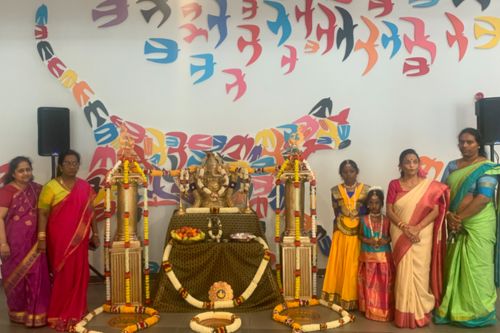 Celebrating Diwali women in traditional hundu dress in the atrium